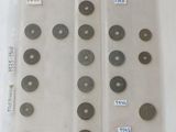several different types of metal discs are displayed on a white surface