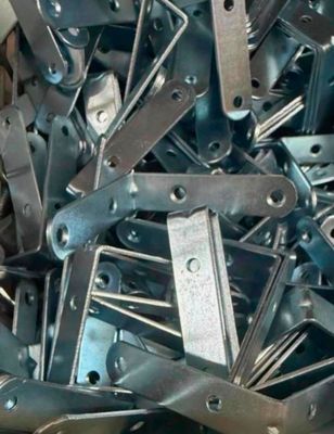 a large pile of metal tools that are in a bin