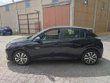 a picture of a black car parked in front of a building