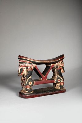 an image of a small wooden stool with a horse on it