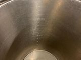 a close up of a metal bowl on a counter