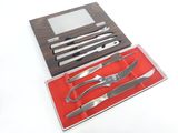 a set of knives and a knife sharper in a box