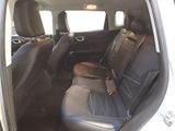 the back seats of a white car with black leather trims