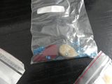 a bag of food and a pair of scissors on a table