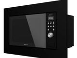 the microwave is black and has buttons on the side of it