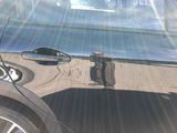 a reflection of a fire hydrant on the side of a car