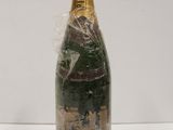 a close up of a bottle of champagne on a table