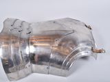 a close up of a metal object on a white surface