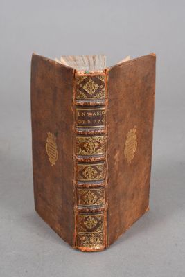 an old book that is sitting on a table