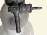 a metal object that is sitting on top of a marble base
