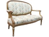 an image of a couch with a floral upholstered back
