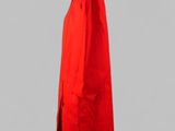 a red coat on a mannequin stand against a gray background