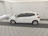 a picture of a white car parked in a garage