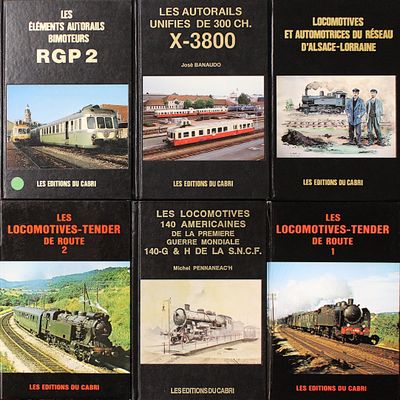 quatre livres consacrés à différents types de trains, exposés sur une table