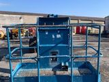 a blue work platform sitting in the middle of a parking lot