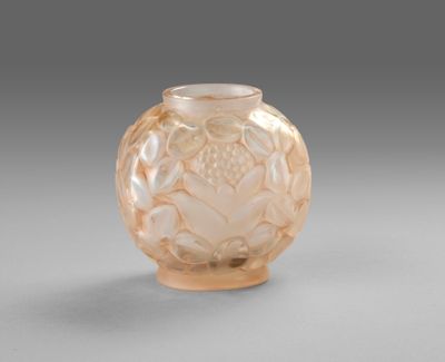 a glass vase that has a flower design on it