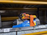 a machine that is sitting on a shelf in a warehouse