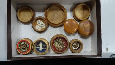 a box filled with different types of wooden bowls