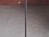 a lamp that is sitting on a stand in a room
