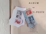 a book with two stamps on it and a bookmark on top of it