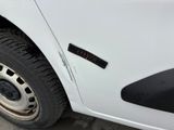 a close up of a car ' s tire with a sticker on it