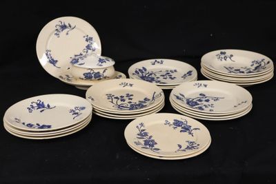 six plates with blue flowers on them on a black background