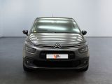 the front of a grey citrole parked in a large room