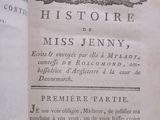 an old book with a picture of a town on it