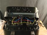 a black box with wires in it sitting on a table