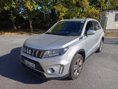 a picture of a silver suv parked in a parking lot