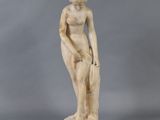 an image of a statue of a woman with a hat on her head