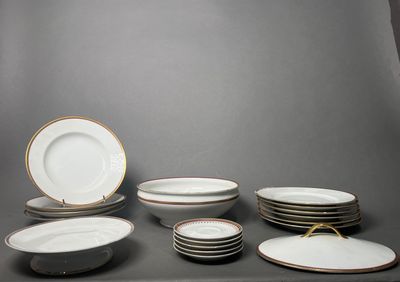 many plates and bowls sitting on a table