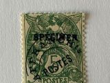 a green stamp with a picture of a bird on it