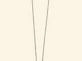 a long necklace with a bird hanging from it ' s neck