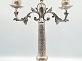 silver plated candelabra with three candles on a stand