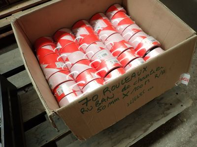a cardboard box full of red and white soda cans