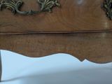 a wooden table with a clock on top of it