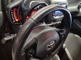 a close up of a steering wheel in a car