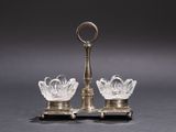 pair of cut glass candlesticks on stand