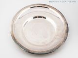 a silver plate that is sitting on a table