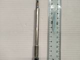 a pen and ruler on a table next to a ruler