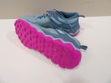 pair of blue and pink running shoes on a white surface