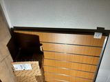 a wooden door that is open in a room
