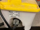 a yellow and white boat on a shelf in a store