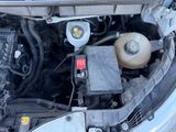 a car engine with the hood open and the battery in it