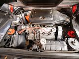 the engine compartment of a car with its hood open