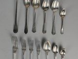 a lot of spoons and spoon spoons on the table