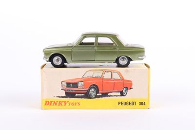 a green toy car sitting on top of a box