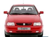 a red car that is parked in front of a white background