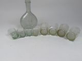 a lot of glass bottles sitting on a white surface